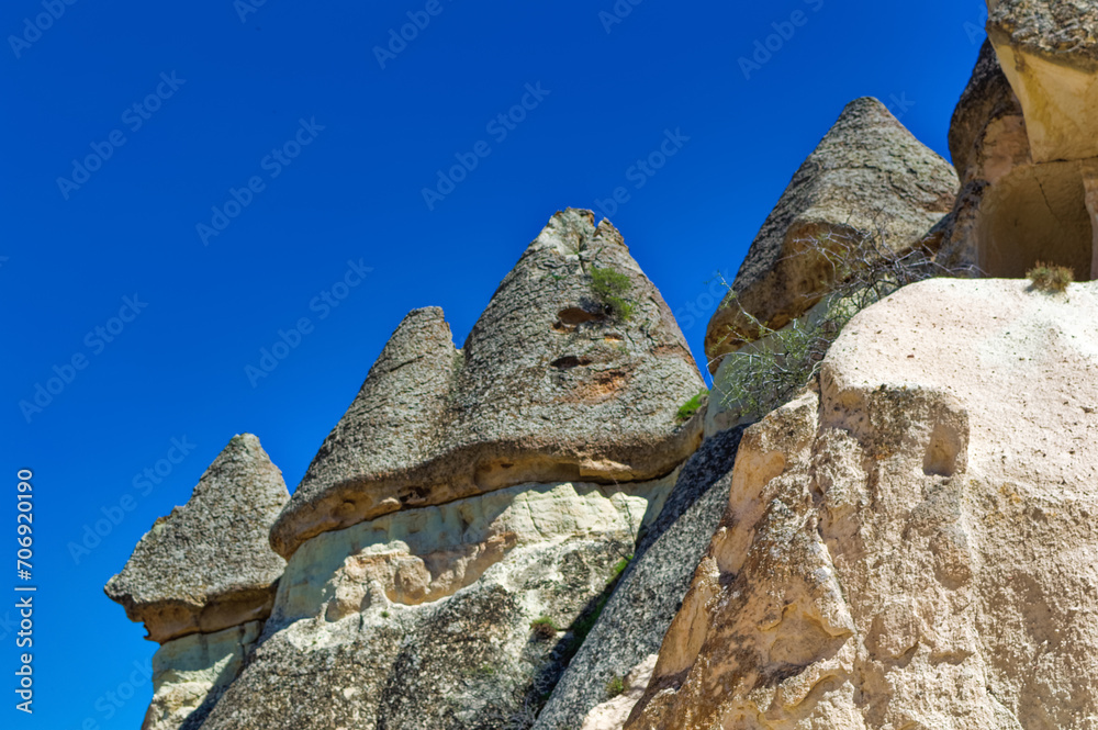 Cappadocia landscape soft volcanic rock, shaped by erosion into towers.
