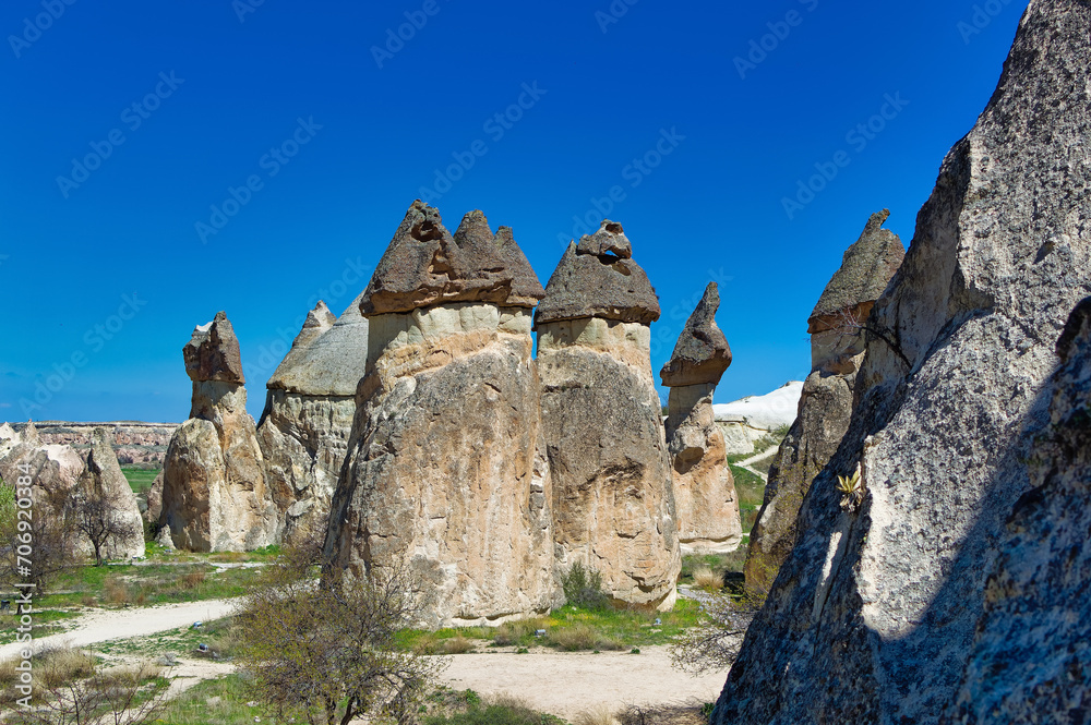 Cappadocia landscape soft volcanic rock, shaped by erosion into towers.