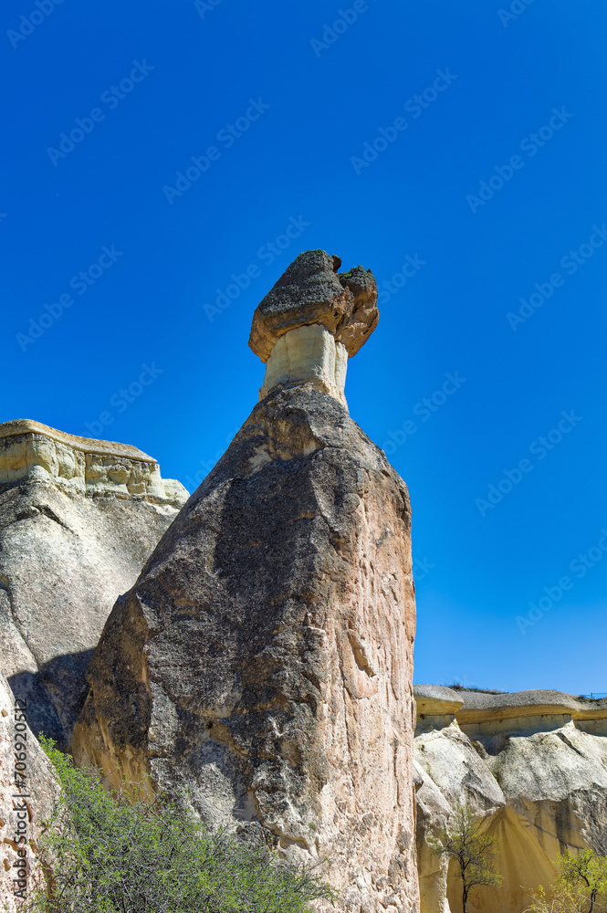 Cappadocia landscape soft volcanic rock, shaped by erosion into towers.