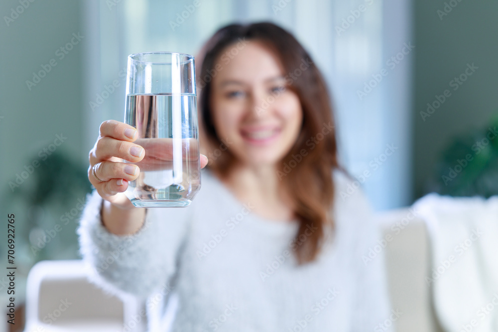Woman drinking water at home Woman drinking water at home