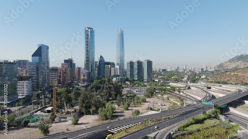 Aerial View Of Gran Torre Santiago, La Portada And Titanium Park Buildings On Sunny Day With Blue Skies. Parallax Shot photo