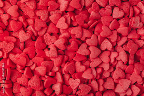 Red hearts background. Sweet candy hearts as background. Valentines day background