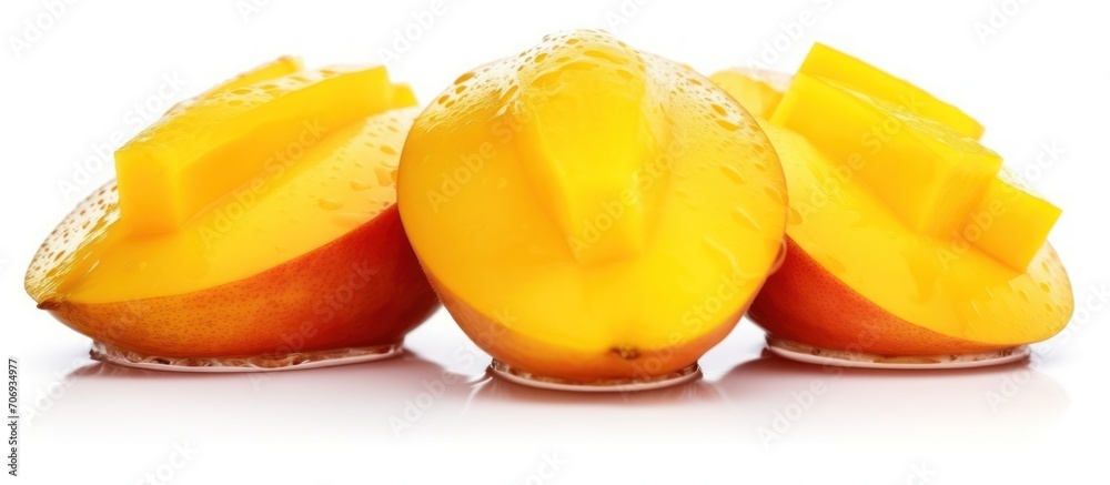Mango fruit slices and water drops isolated on white background Mango fruit slices and water drops isolated on white background