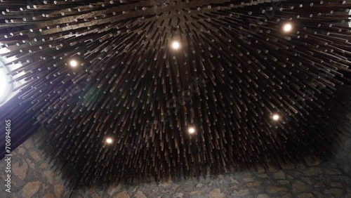 A ceiling with a lot of wooden sticks