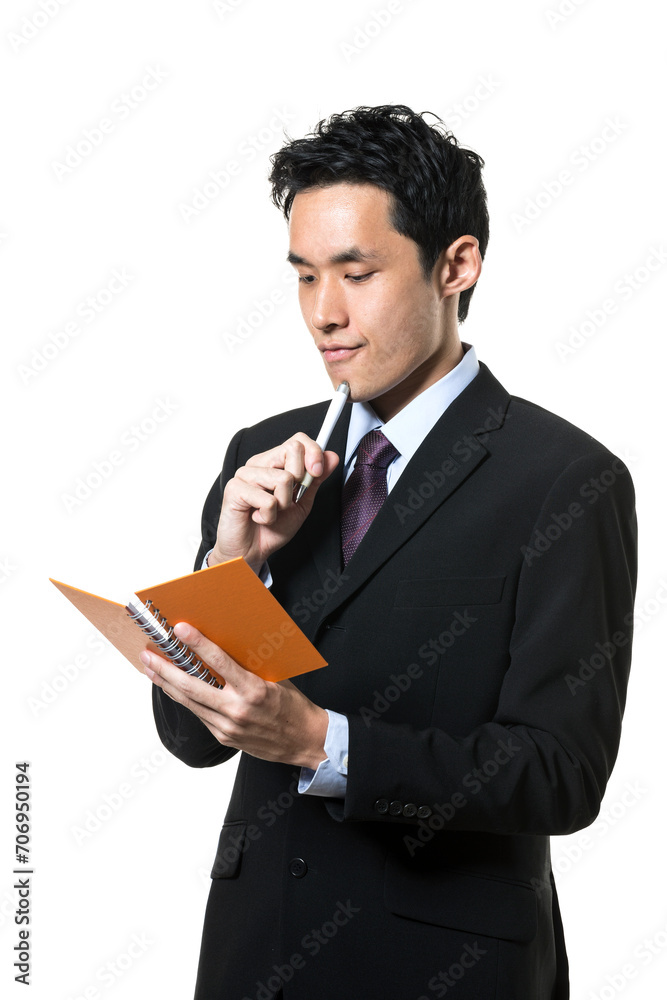 Asian business man taking notes. Asian business man taking notes.