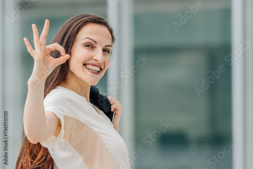 business woman with okay gesture photo