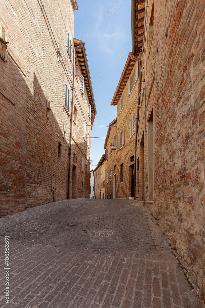 One of the narrow streets of the old town in Urbino, Italy