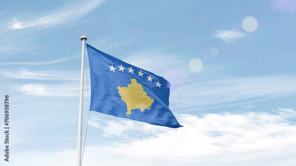 Kosovo national flag cloth fabric waving on the sky - Image