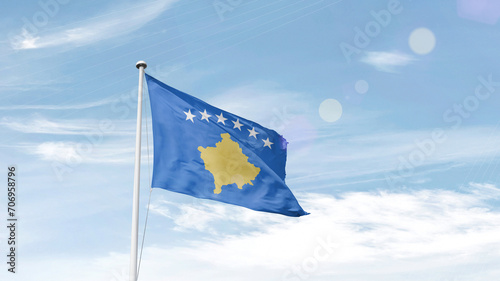 Kosovo national flag cloth fabric waving on the sky - Image