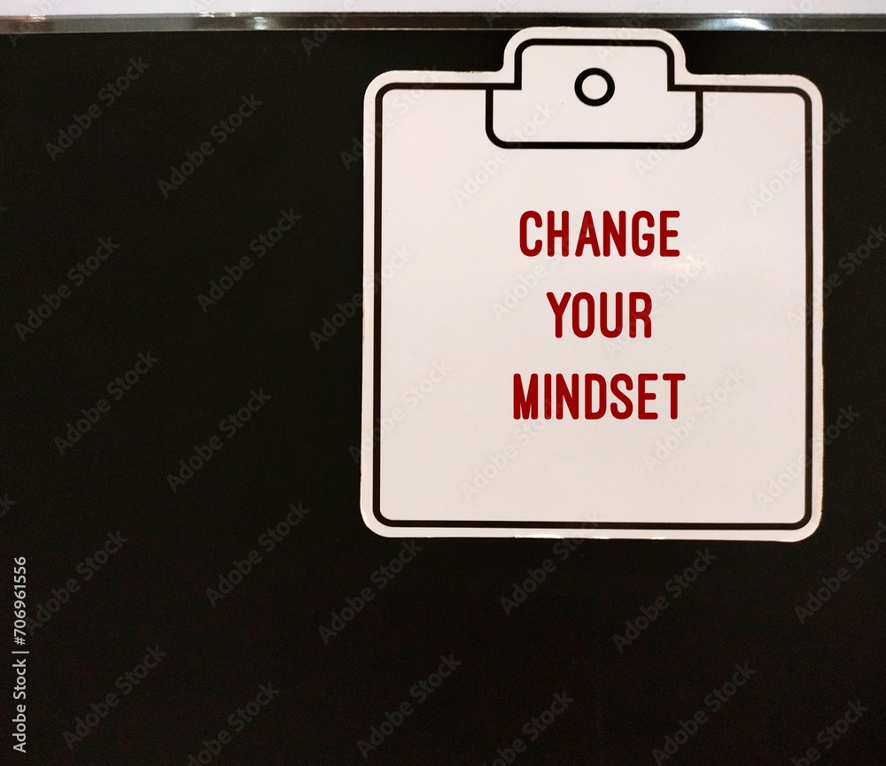 CHANGE YOUR MINDSET stick note on black copy space wall, to change way of thinking that influences negative behavior, shifting habits and thought patterns to improve well-being in life CHANGE YOUR MINDSET stick note on black copy space wall, to change way of thinking that influences negative behavior, shifting habits and thought patterns to improve well-being in life
