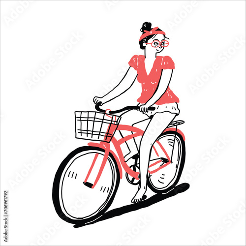 Pretty girl riding a bicycle in casual clothes.