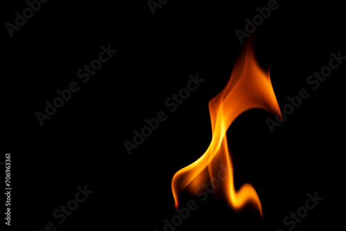 Hot flames on a black background. Beautiful flame of fire in the dark. Abstract of burning flames and smoke.