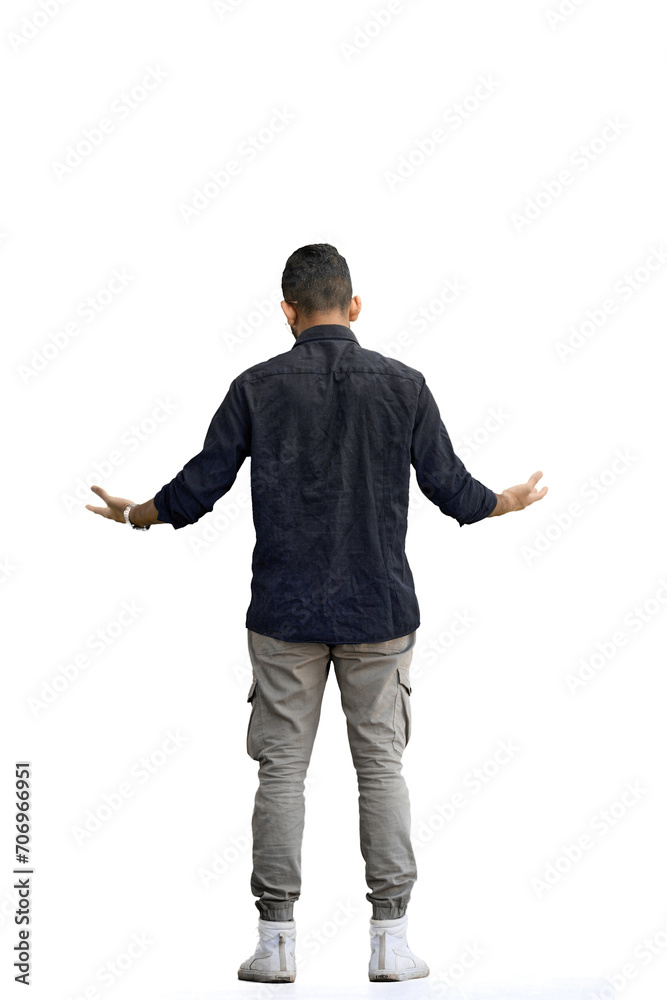 A man, on a white background, in full height, spreads his arms