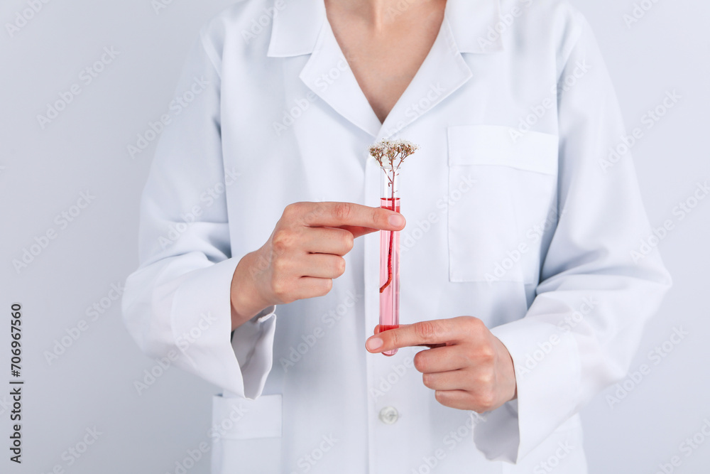 Test tube and flowers, Herbal medicine, concept of herbal medicine research Test tube and flowers, Herbal medicine, concept of herbal medicine research
