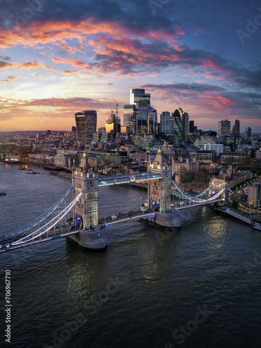 Aerial sunset view of the famous Tower Bridge in London and the skyscrapers of the city in the background  England