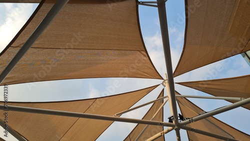 Canvastavla Canvas roof on steel structure, blue sky background