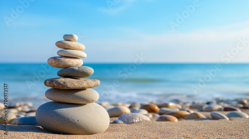 Vacation relax summer holiday travel tropical ocean sea panorama landscape - Close up of stack of round pebbles stones on the sandy sand beach, with ocean in the background photo