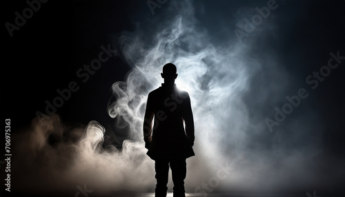 Silhouette of ghost,mans spirit on a dark background. And his shadow in smoke.death day concept, copy space.