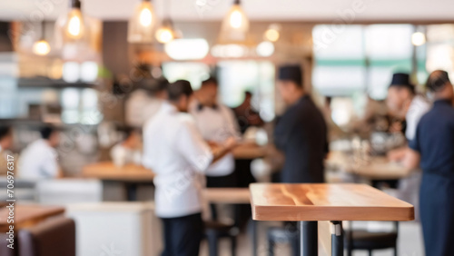 Blurred coffee shop or cafe restaurant, Blurred restaurant background with some people and chefs and waiters working.
