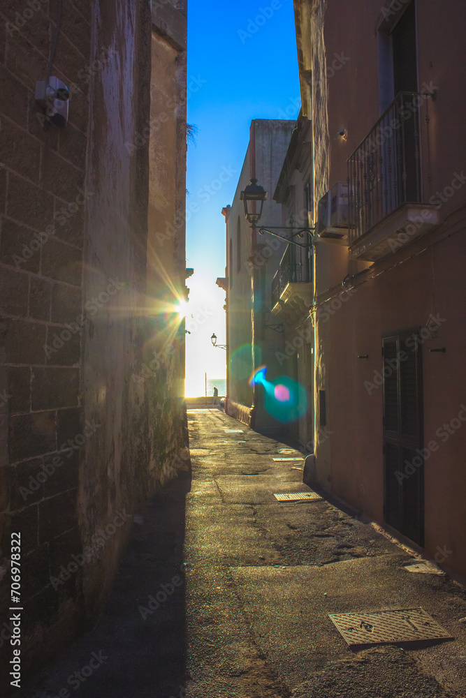 Sun rays on one of the streets of Gallipoli Sun rays on one of the streets of Gallipoli
