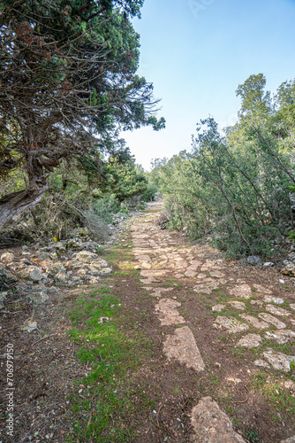 Scenic views of Roman road near Uzuncaburç, is an archaeological site in Mersin Province, Turkey, containing the remnants of the ancient city of Diokaisareia or Diocaesarea. photo
