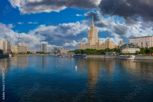 Serene Moscow Cityscape with Seven Sisters Building, Dynamic Sky, and Reflective River at Sunset