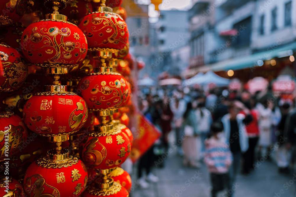 Little red lanterns, Chinese New Year decorations. Crowed street during spring festival. Translation: blessing.