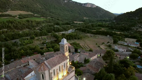 The chapel Notre-Dame de la Consolation, built in 1894 atop a rocky spur overlooking a village in Pierrelongue. The chapel is designed like Notre-Dame de Lourdes basilica.  photo