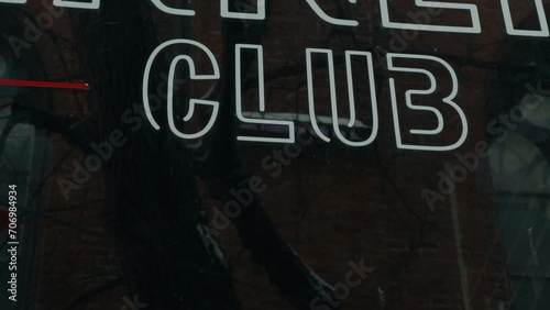 Evening entertainment: Night club sign displayed on the window photo