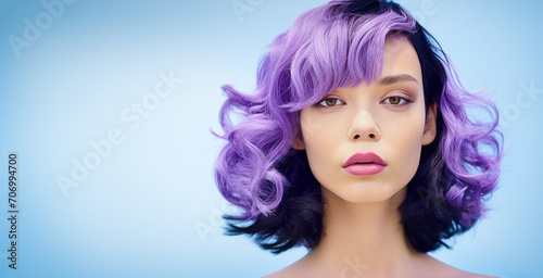 beautiful young woman with purple hair, on a blue background, a place for text