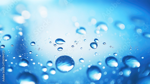 macrophotography of water droplets on a blue background