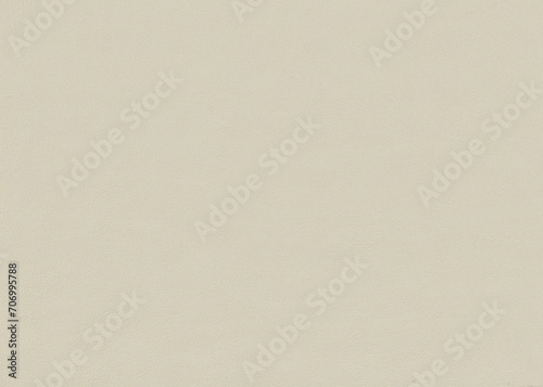 Background of beige paper wallpaper or plastered wall with uniformly chaotic texture.