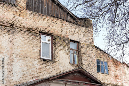 Old wooden double sash window and PVC white window. Brick wall © Professional Art