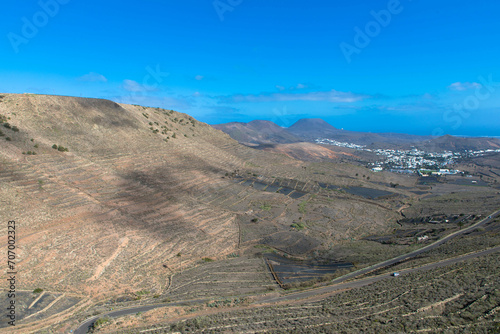 Spectacular view of the Fire Mountains at Timanfaya National Park, this unique area consisting entirely of volcanic soils. Volcanic landscape in a sea of ​​lava. Lanzarote, Spain