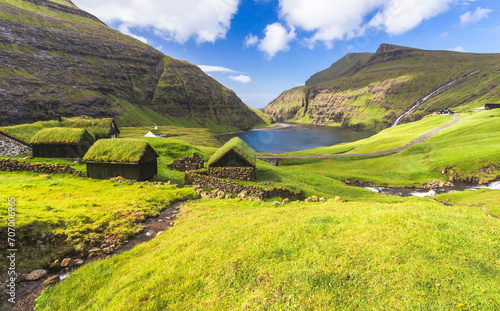 Nordic natural landscape, Saksun, Stremnoy island, Faroe Islands, Denmark. Iconic green roof houses. photo