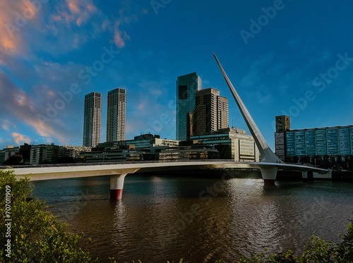 Puente de la Mujer Bridge at Sunrise or Sunset in Puerto Madero, Buenos Aires, Argentina with Modern Skyline photo