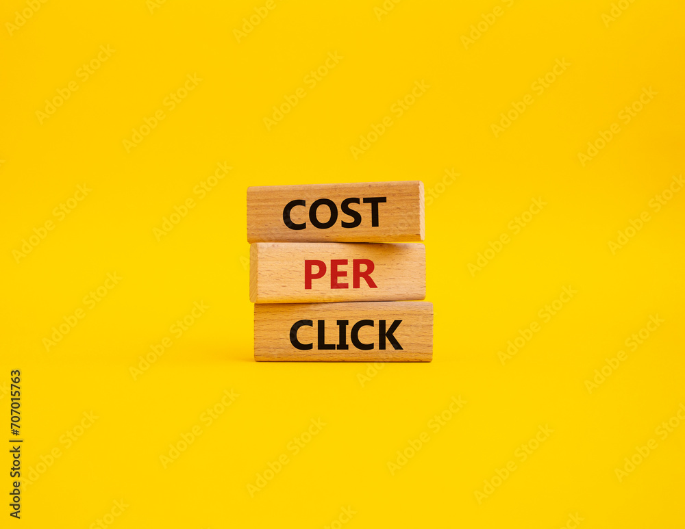 Cost Per Click symbol. Concept word Cost Per Click on wooden cubes. Beautiful yellow background. Business and Cost Per Click concept. Copy space. Cost Per Click symbol. Concept word Cost Per Click on wooden cubes. Beautiful yellow background. Business and Cost Per Click concept. Copy space.