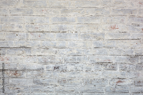 Old grungy brick wall texture. Brickwall backdrop. Stonewall wallpaper. Vintage wall with obsolete plaster