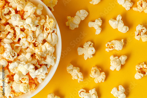 plate with popcorn on a yellow background