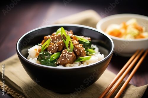 beef teriyaki bowl with steamed rice and green onions