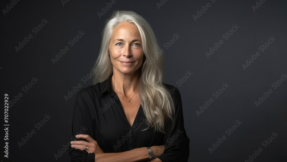 Portrait of a beautiful mature businesswoman on a dark background Portrait of a beautiful mature businesswoman on a dark background