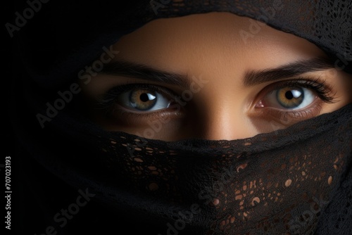 Beautiful Muslim woman with sharp eyes with a veil and beautiful, charming eyes