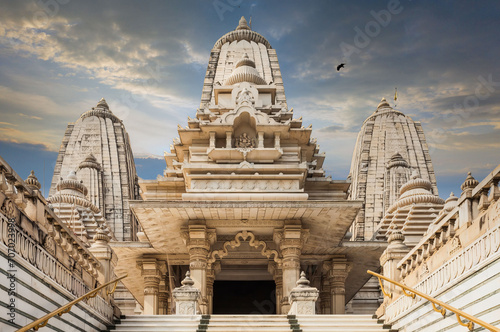 Majestic White Marble Hindu Temple with Ornate Shikharas and Carvings, India, Warm Glow Lighting photo