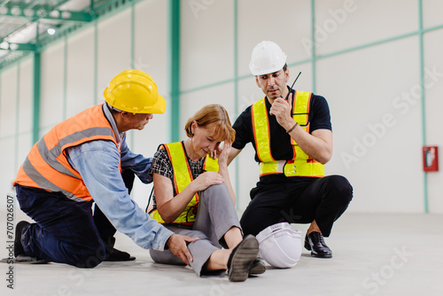Senior adult engineer women faints sick health problem falling down accident at workplace team staff help support photo