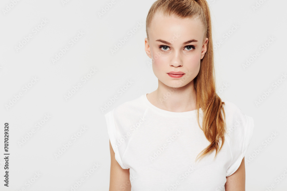 Serious, teenager and portrait with fashion in studio and white background with confidence and pride. Beauty, face and girl with a ponytail in casual trendy style with makeup in mock up space Serious, teenager and portrait with fashion in studio and white background with confidence and pride. Beauty, face and girl with a ponytail in casual trendy style with makeup in mock up space