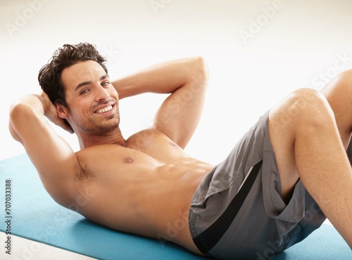 Fitness, sit ups or happy man training for six pack, abs or strong stomach muscles on mat in exercise. Abdomen, white background or healthy athlete in calisthenics for core or body workout in studio