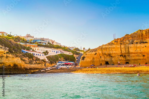 Beautiful limestone Algarve coast with village of Benagil, south of Portugal