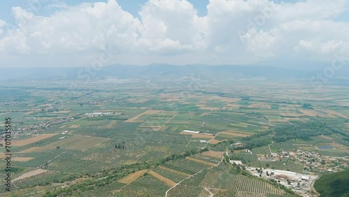 Lamia, Phthiotis, Greece. Panorama of the valley with fields. Olive trees, colorful fields. Summer, Cloudy weather, Aerial View photo
