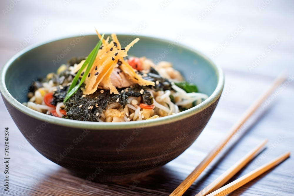 ramen bowl with nori, bamboo shoots, sesame seeds