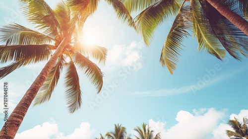 Palm trees on tropical beach, coconut trees. Tropical trees with sunlight in the sky, sunset and clouds abstract background. Vintage tone filter effect color style.